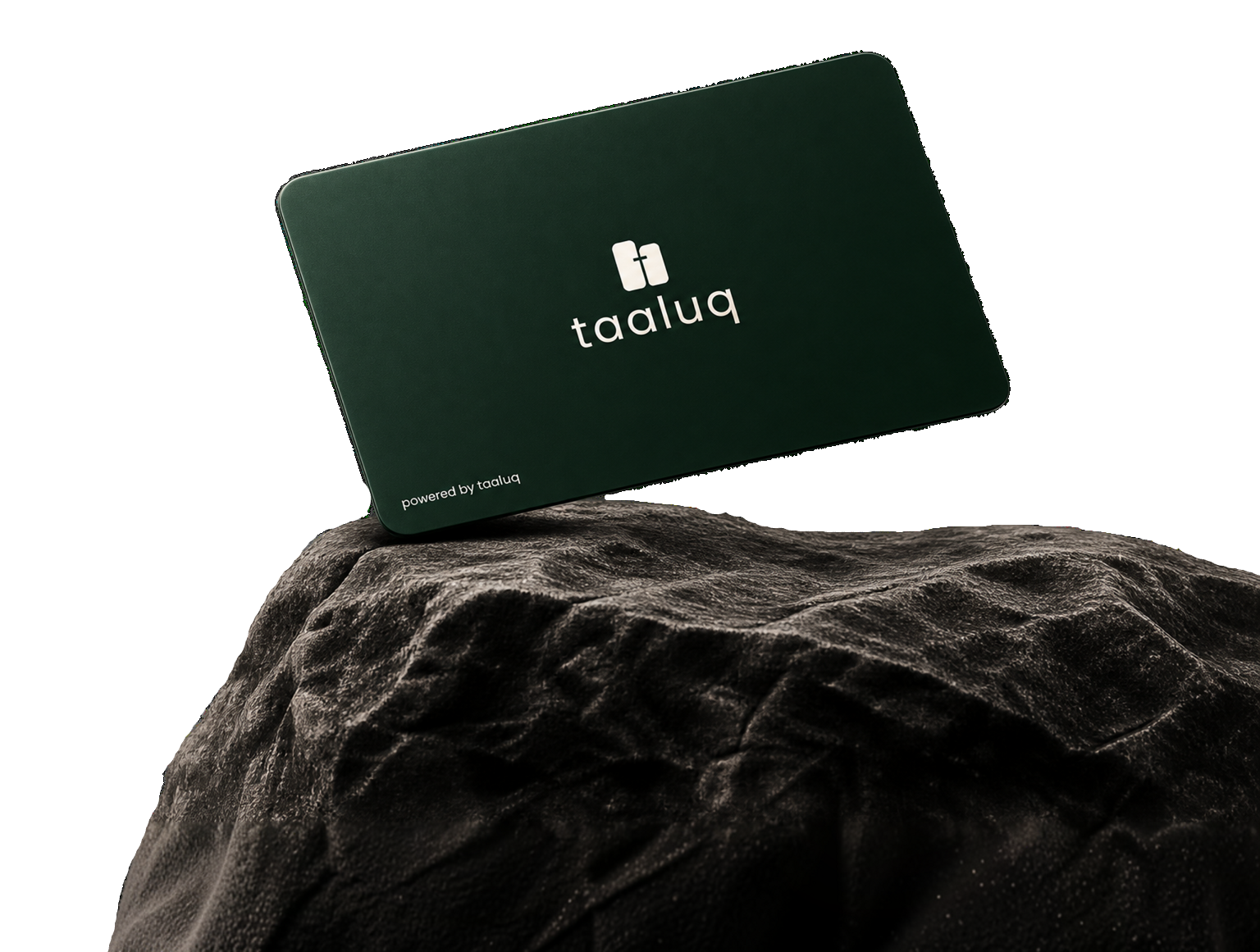 Taaluq black NFC card resting on a rock